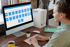 A woman using Sencha's React components to create a React web app